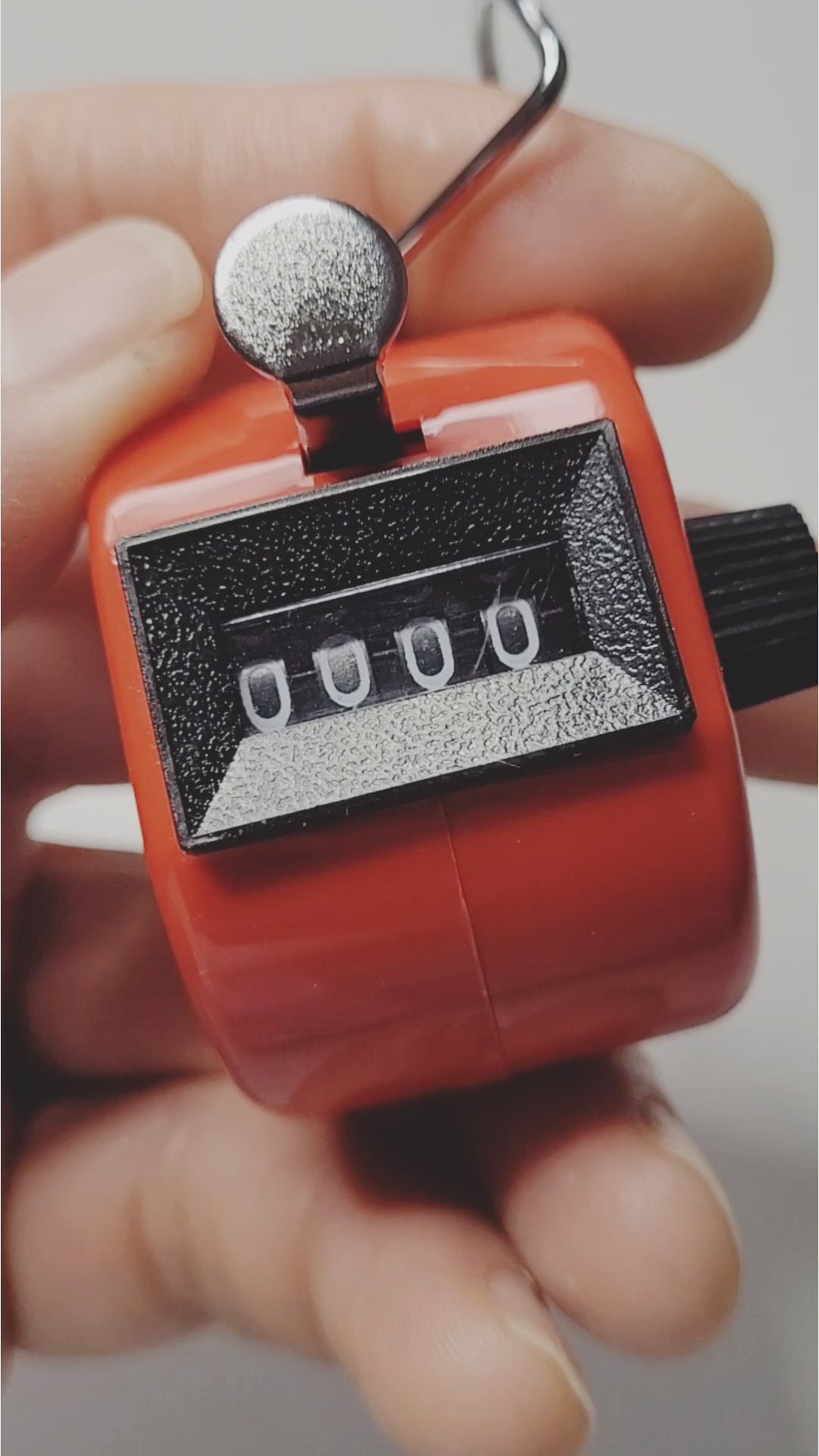 Close-up of red KondiMaster Punch Counter displaying 0000, perfect for counting in sports and fitness training.